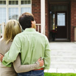 Happy couple buying home